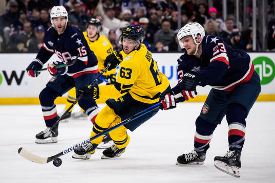Jesper Bratt of Sweden and Adam Fox of USA