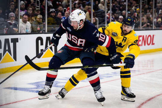 J.T. Miller of USA and Erik Karlsson of Sweden
