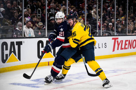 Dylan Larkin of USA and Rasmus Dahlin of Sweden
