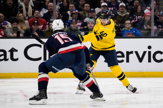 Noah Hanifin of USA and Elias Pettersson of Sweden