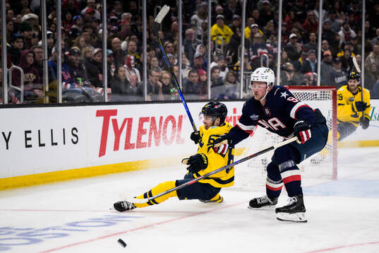Jesper Bratt of Sweden and Jack Eichel of USA