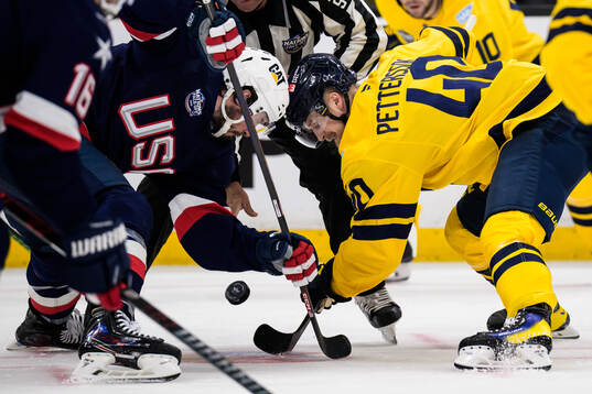 J.T. Miller of USA and Elias Pettersson of Sweden
