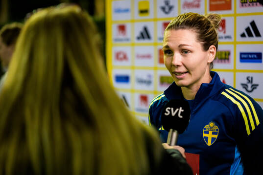 Goalkeeper Jennifer Falk is interviewed by the media