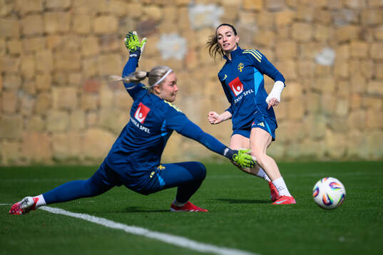 Goalkeeper Sofia Hjern and Kosovare Asllani of Sweden of