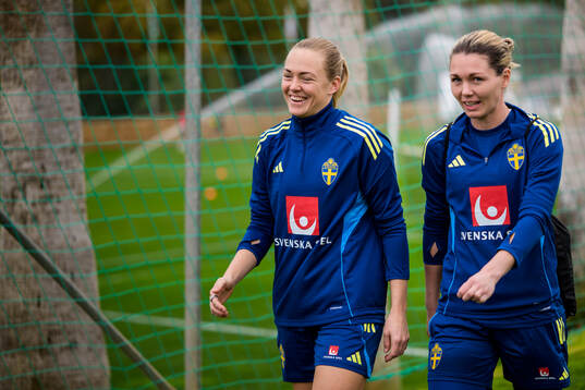 Magdalena Eriksson and goalkeeper Jennifer Falk of the