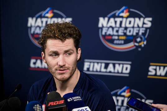 Matthew Tkachuk of USA is being interviewed by media