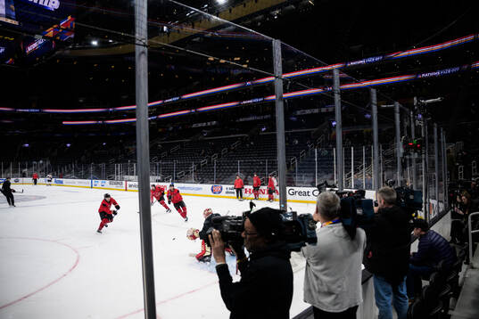 Media covering a practice session of Canada