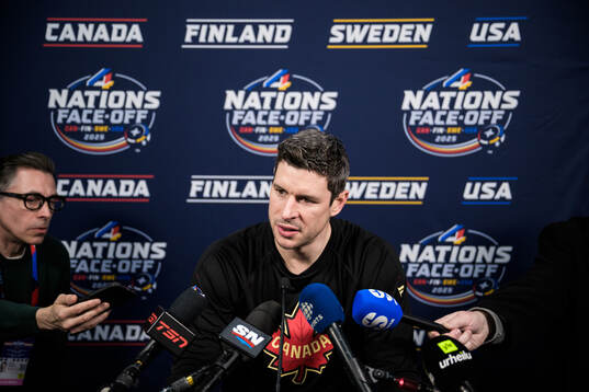 Sidney Crosby of Canada is being interviewed by media