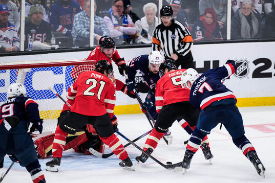 Auston Matthews passes to Brady Tkachuk of USA who scores