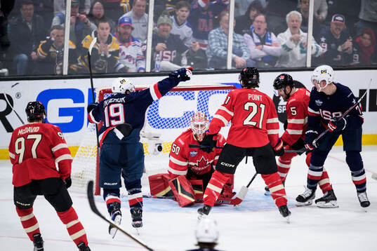 Matthew Tkachuk and Brady Tkachuk of USA celebrate the 1-1