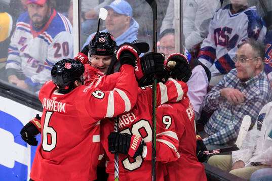 Sam Bennett of Canada celebrates with teammates