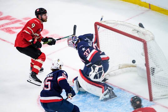 Sam Bennett of Canada scores the 2-2 goal behind goaltender