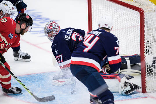 Sam Bennett of Canada challenges goaltender Connor