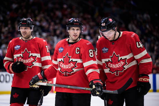 Sam Reinhart, Sidney Crosby and Thomas Harley of Canada