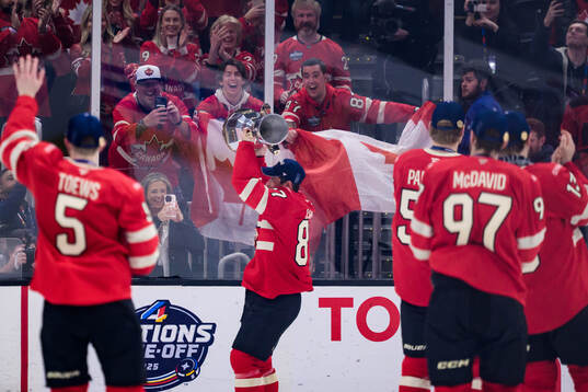 Sidney Crosby of Canada celebrates with the champion’s