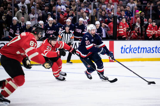 Nathan MacKinnon of Canada and Dylan Larkin of USA