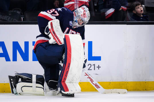 Goaltender Connor Hellebuyck of USA looks dejected