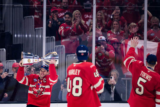 Sidney Crosby of Canada celebrates with the champion’s