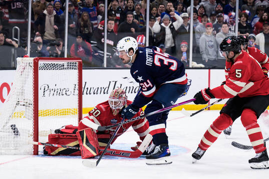Goaltender Jordan Binnington of Canada and Auston Matthews