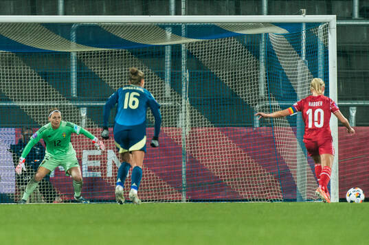 Pernille Harder of Denmark scores the 1-1 goal behind