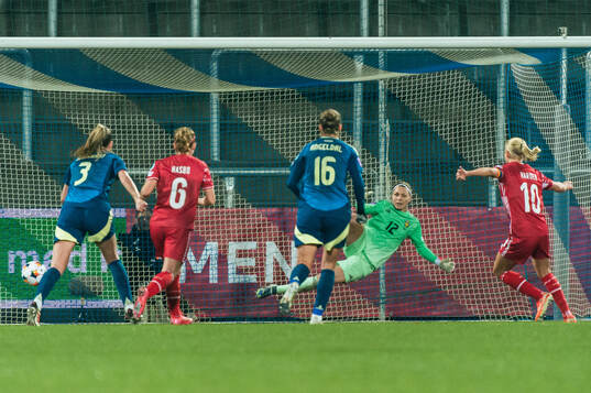 Pernille Harder of Denmark scores the 1-1 goal behind