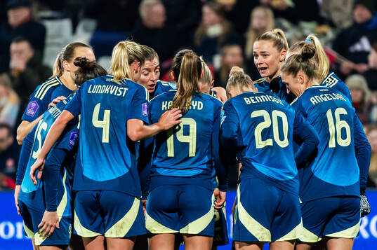Fridolina Rolfö of Sweden celebrate with teammates
