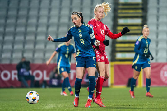 Kosovare Asllani of Sweden and Kathrine Kuhl of Denmark