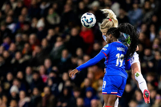 Griedge Mbock Bathy of France and Ada Hegerberg of Norway