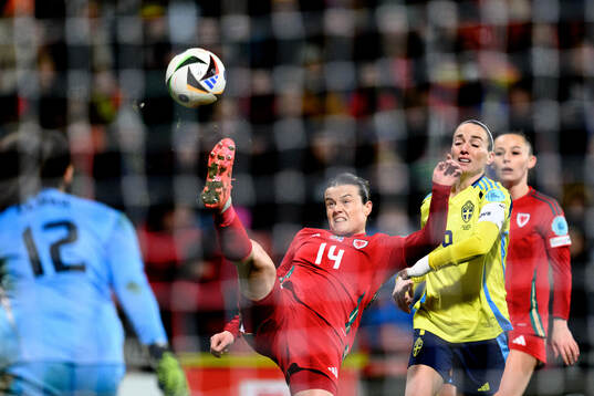 Hayley Ladd of Wales and Kosovare Asllani of Sweden
