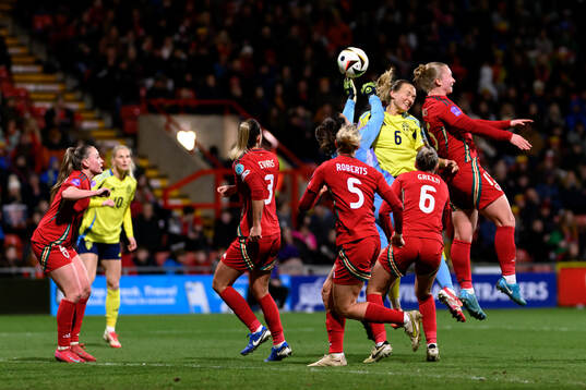 goalkeeper Olivia Clark of Sweden and Magdalena Eriksson of
