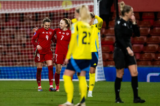 Kayleigh Barton of Wales scored 1-1 and celebrates with