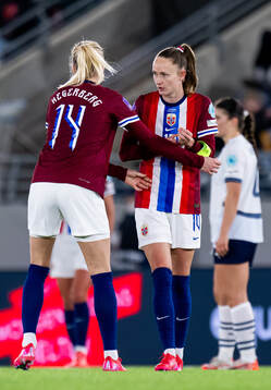 Ada Hegerberg of Norway gives the captains’ armband to