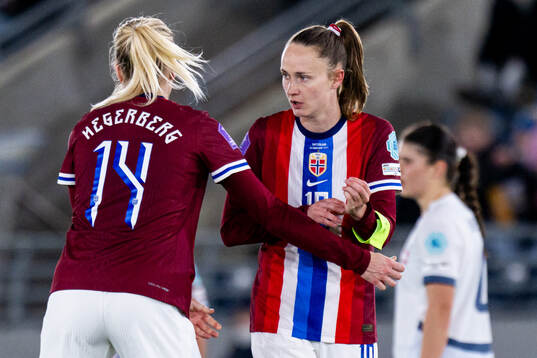 Ada Hegerberg of Norway gives the captains’ armband to
