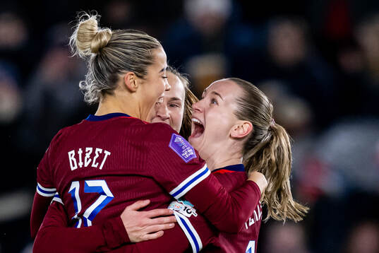 Elisabeth Terland of Norway celebrates with teammates