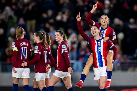 Elisabeth Terland of Norway celebrates with teammate Celin