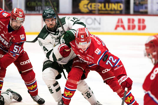 Färjestads Henrik Björklund och Timrås Erik Walli