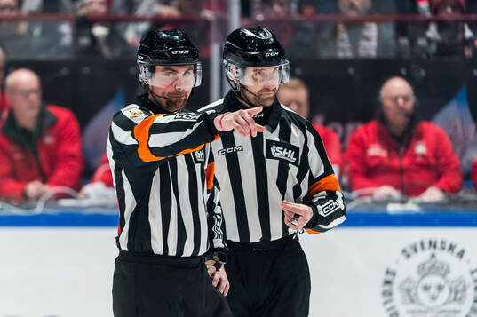 Domare David Laksola och Domare Mikael Sjöqvist