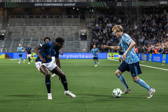 Derrick Luckassen of Pafos and Oskar Fallenius of