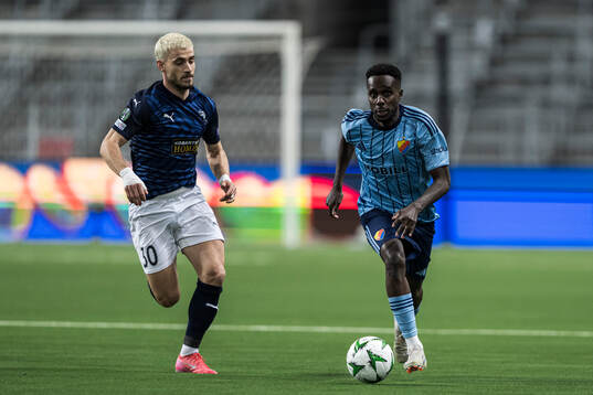 Vlad Dragomir of Pafos and Tokmac Nguen of Djurgården