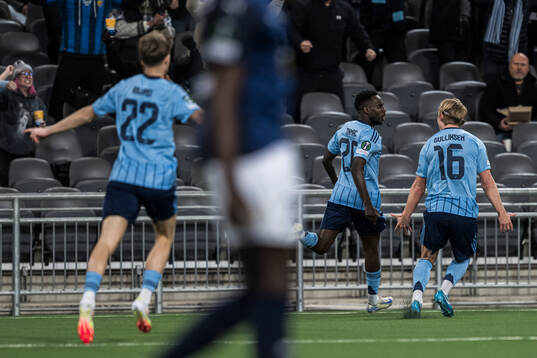 Tokmac Nguen and Tobias Gulliksen of Djurgården celebrate