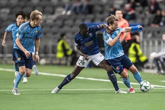 Ken Sema of Pafos and Oskar Fallenius and Daniel Stensson