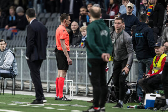 Referee Sebastian Gishamer with a VAR check of the 2-0 goal
