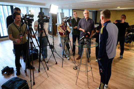 Swedish journalists and head coach Jon Dahl Tomasson of the