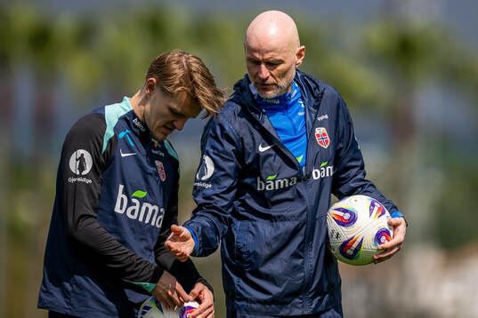 Martin Ødegaard and Ståle Solbakken, head coach of the