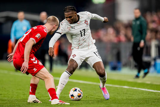 Rasmus Kristensen of Denmark and Rafael Leao of Portugal