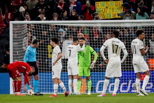 Cristiano Ronaldo and goalkeeper Diogo Costa of Portugal