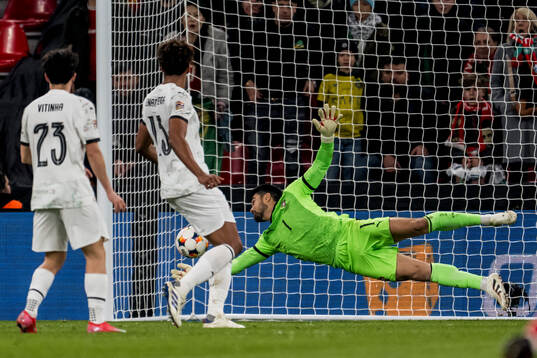 of Portugal goalkeeper Diogo Costa makes a save
