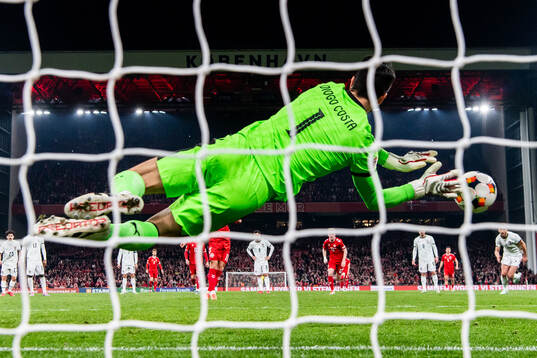 Goalkeeper Diogo Costa of Portugal saves a penalty against