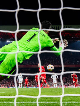 Goalkeeper Diogo Costa of Portugal saves a penalty against