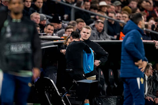 Referee Irfan Peljto receives a new headset